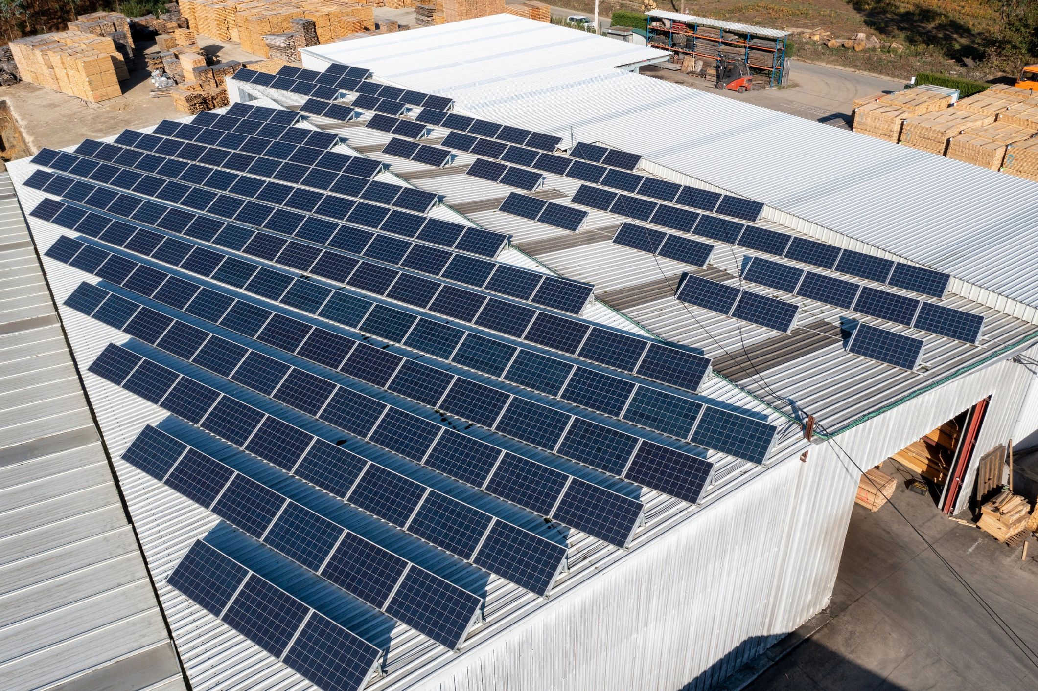 Solar panels on warehouse roof producing clean energy